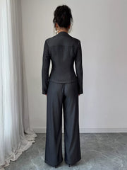 Gray button-up shirt and wide-leg pants set with contrast stitching.