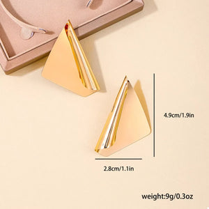Gold sculptural triangle earrings with elegant design and polished finish.
