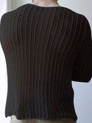 Black open-knit crewneck long sleeve sweater with a textured pattern.