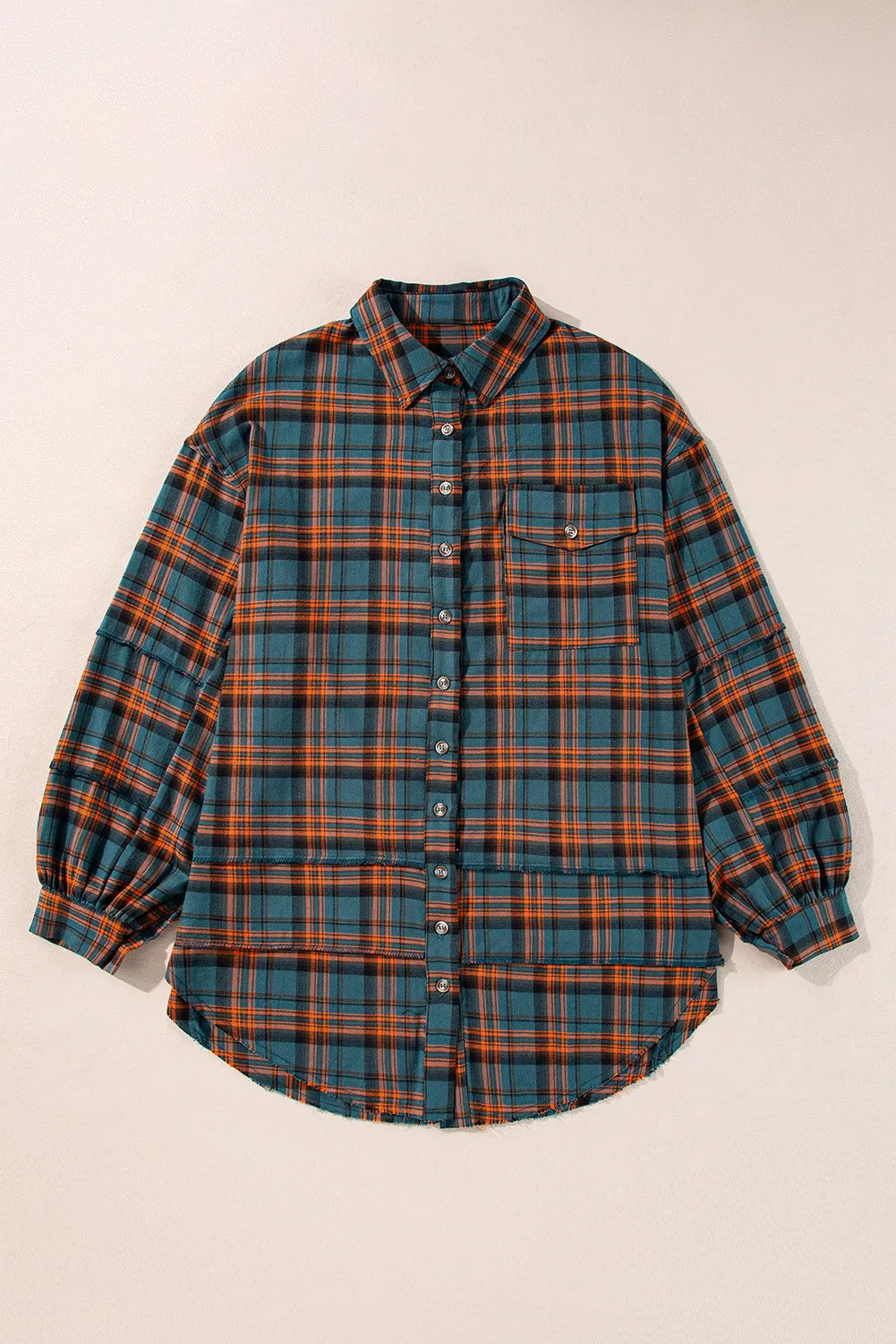 Oversized plaid overshirt in French Blue with layered hem and button front.