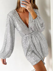 Silver sequin wrap romper with blouson sleeves and deep V-neck.