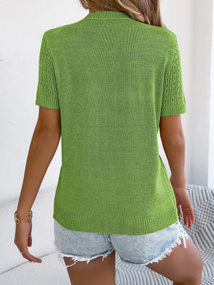 Green knit button-up cardigan with short sleeves and open knit detail on sleeves