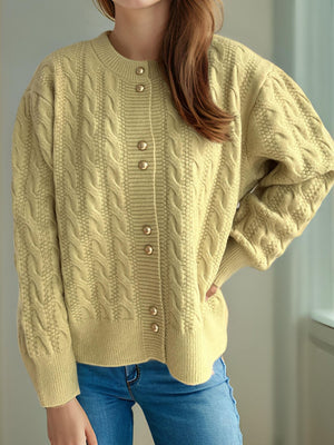 Pastel Yellow cable knit cardigan with puff sleeves and gold buttons.