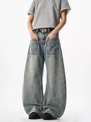 Belted wide-leg blue denim jeans with large front pockets and a washed finish.