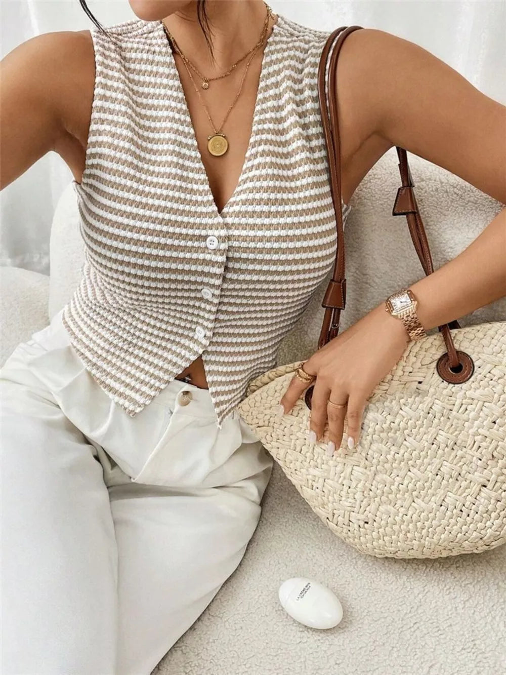 Chic striped knit v-neck tank top with button front in taupe and white.