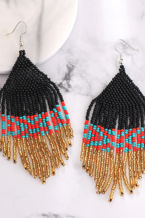 Geometric fringe beaded earrings in black, red, turquoise, and gold.