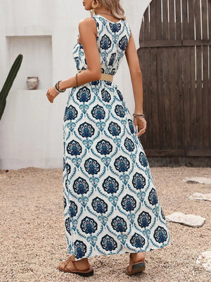 Elegant blue print maxi dress with belt, sleeveless, v-neck, and decorative buttons.