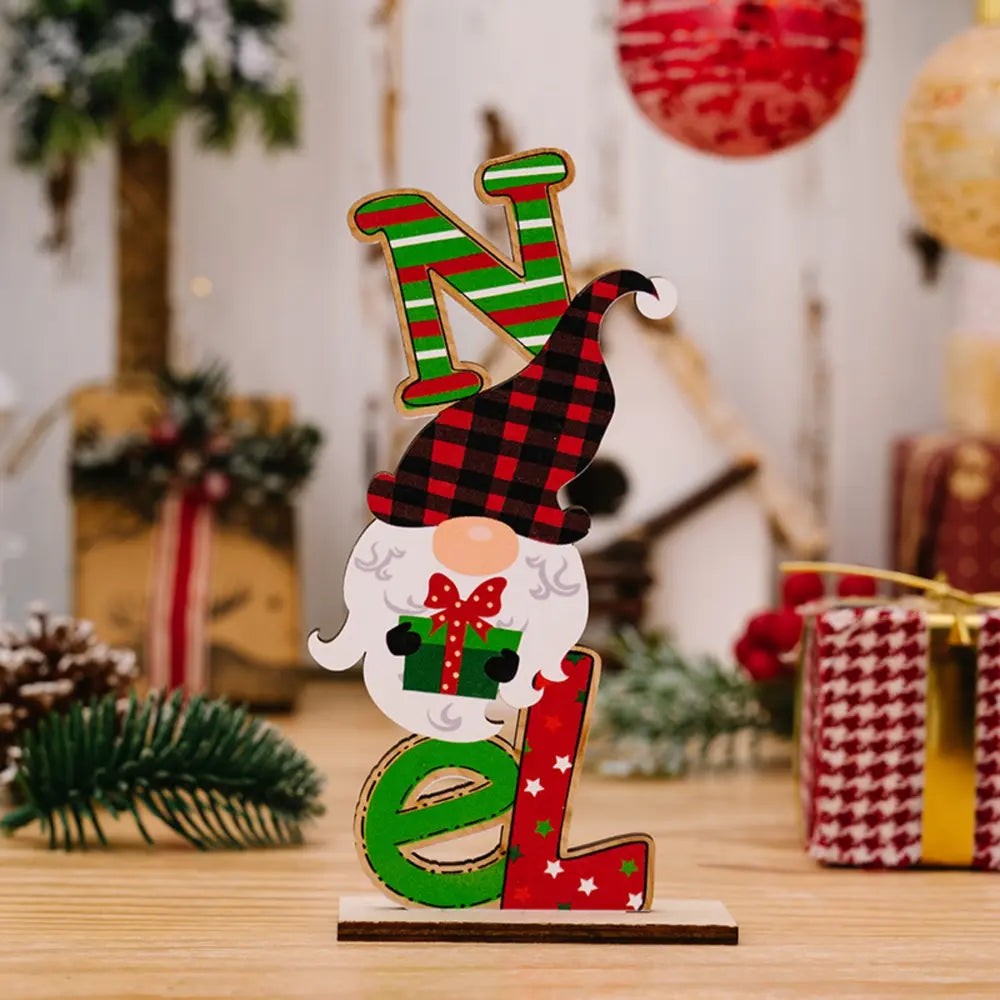 Wooden holiday decor trio spelling NOEL with a gnome holding a gift