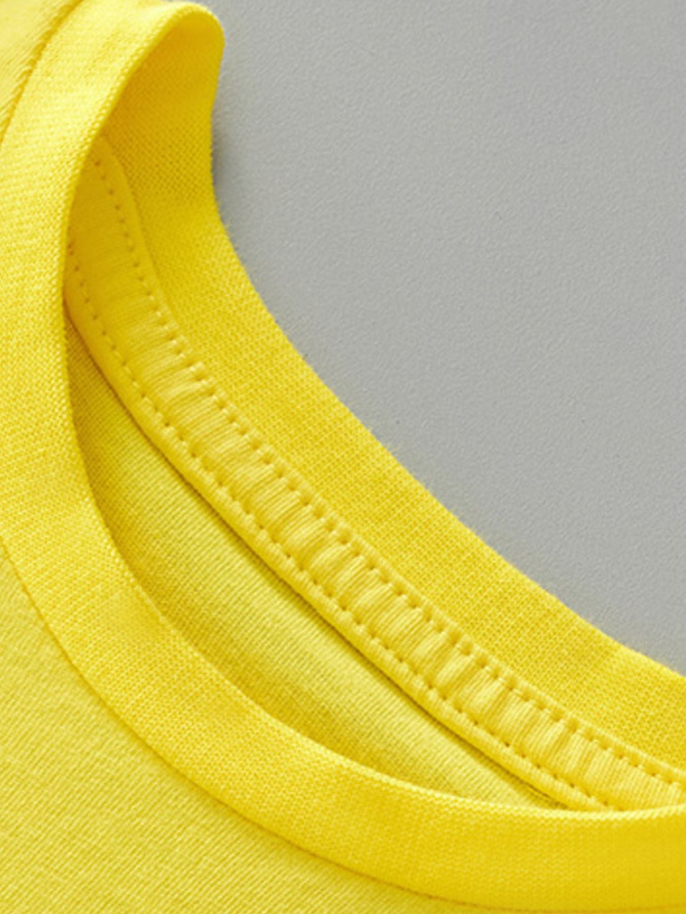 Yellow cotton toddler tee neckline detail with double stitching
