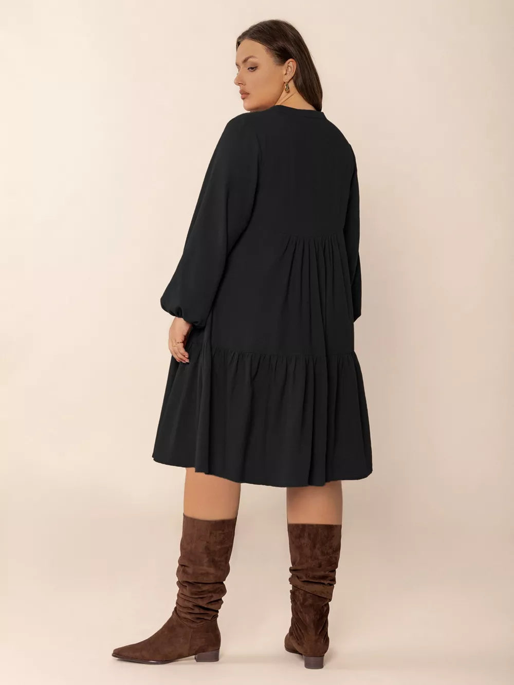 Plus-size black balloon sleeve tiered dress with button front detail.