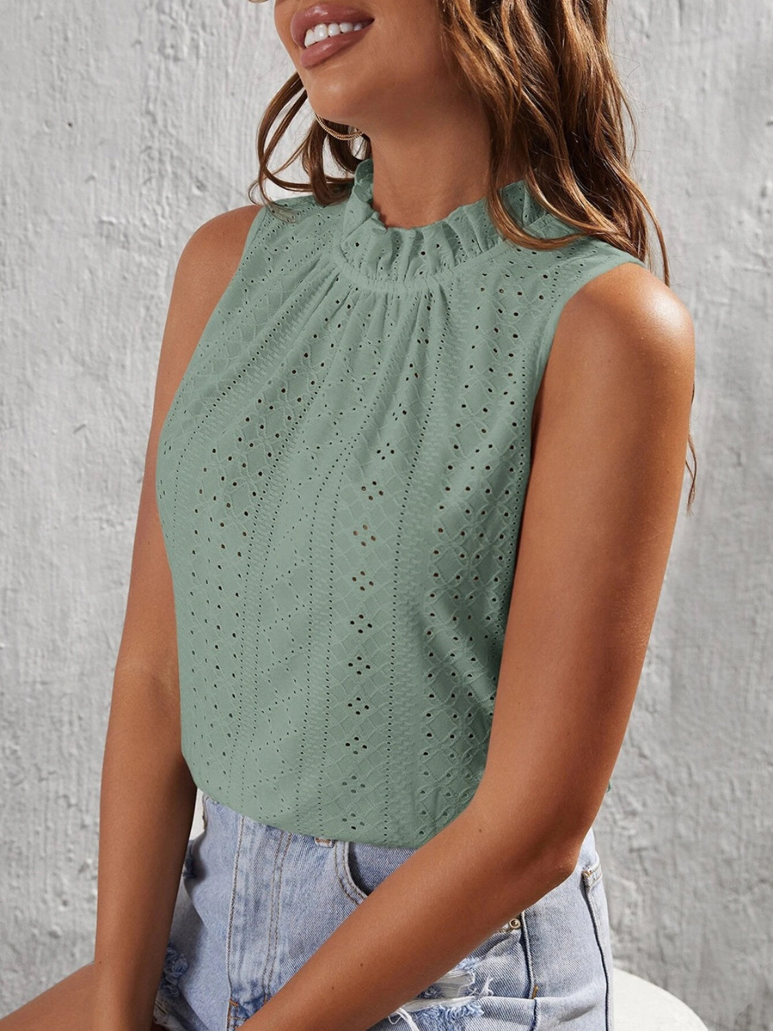 Teal eyelet tank top with ruffled mock neck and sleeveless design