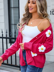 Watermelon pink V-neck cardigan with daisy appliqués and button front.