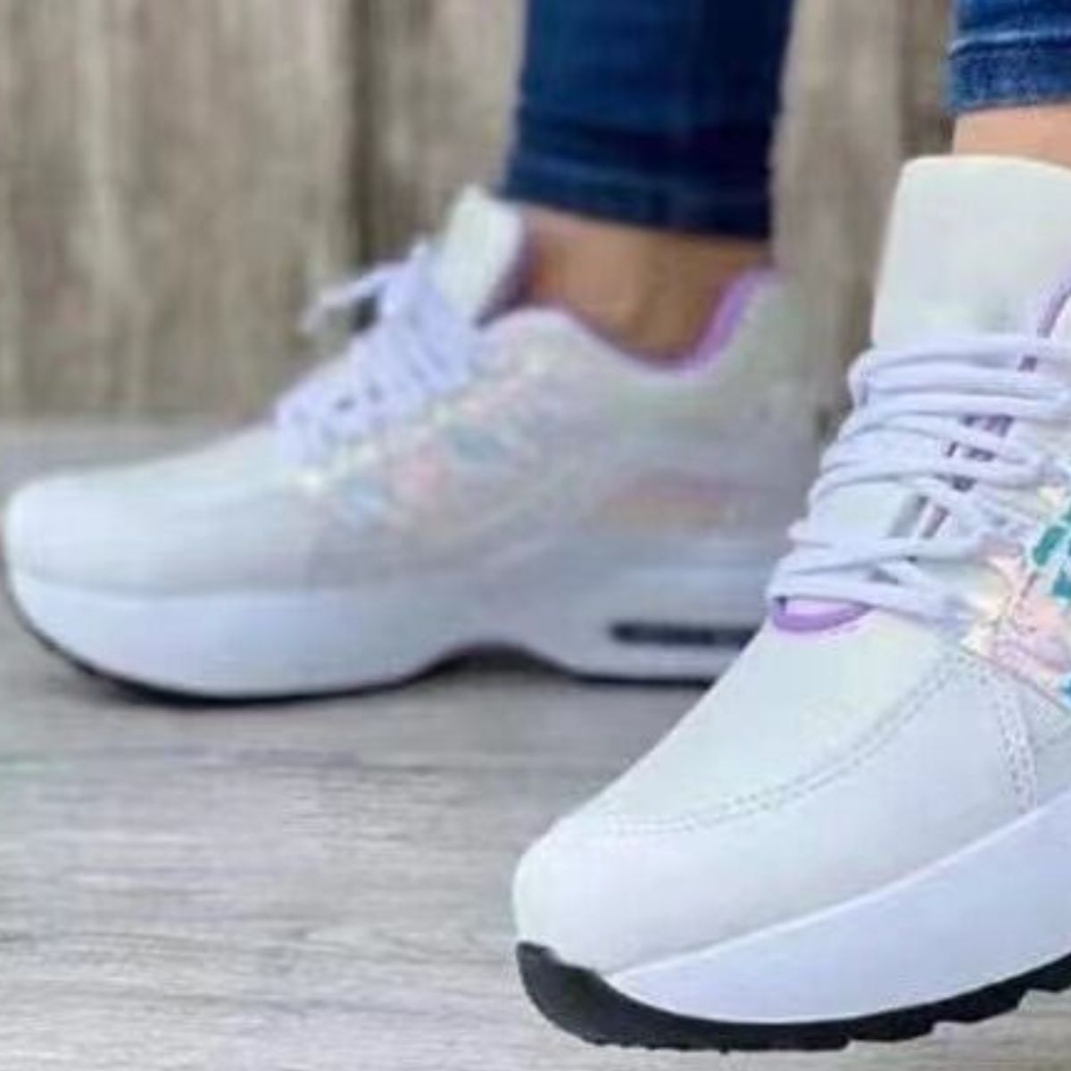 White lace-up chunky platform sneakers with iridescent accents and purple trim.