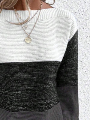Colorblock boatneck ribbed knit sweater in white, black, and gray.