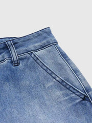 Relaxed high-waisted denim maternity jeans in light blue with pockets and cuffed hem detail.