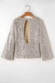Ivory sequin blouson blouse with long bell sleeves and a large back cutout.