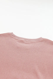 Dusty Pink ribbed crewneck sweatshirt with a subtle heart outline detail.