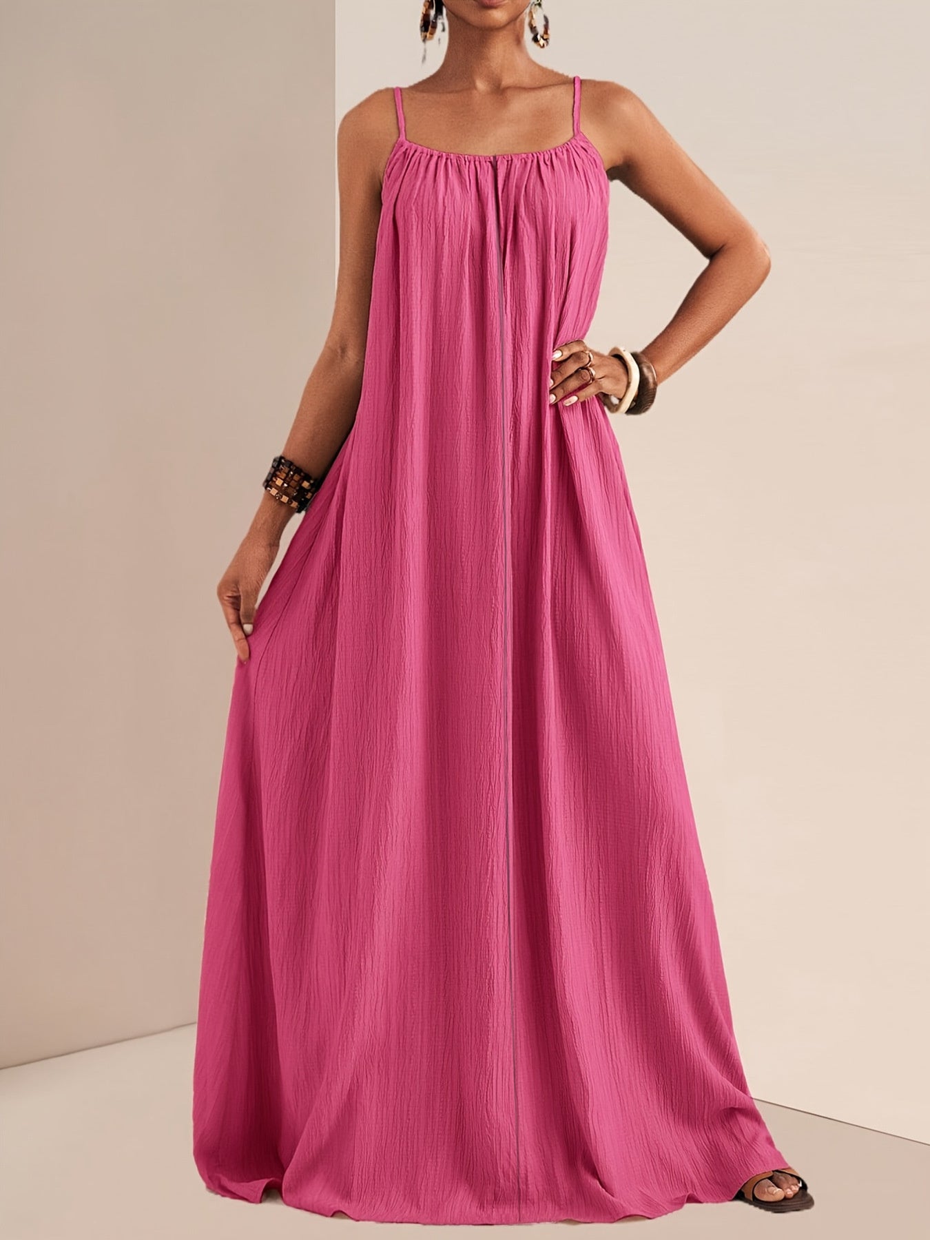 Fuchsia pink maxi swim dress with spaghetti straps and textured fabric.
