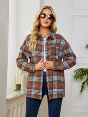 Brown plaid shacket with oversized button detail and chest pocket.