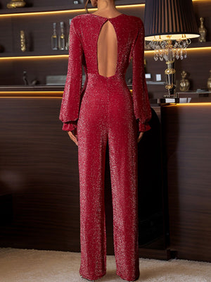 Deep red shimmer jumpsuit with open back and ruffled long sleeves.