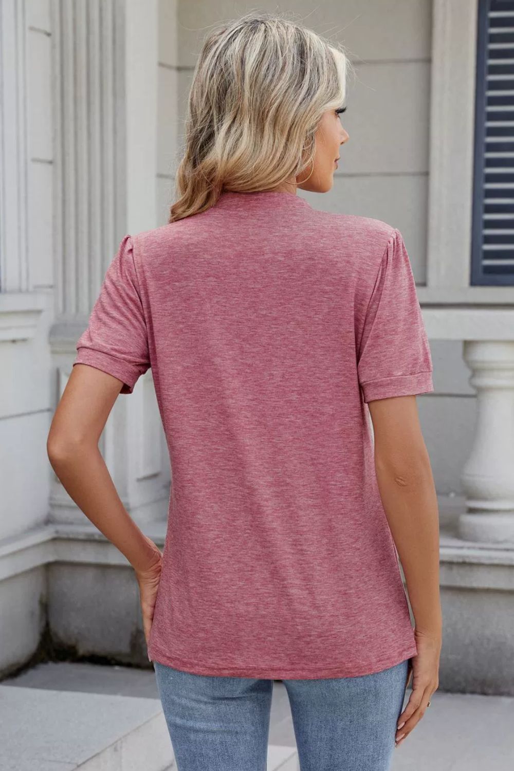 Dusty pink short sleeve blouse with pleated yoke and keyhole neckline.