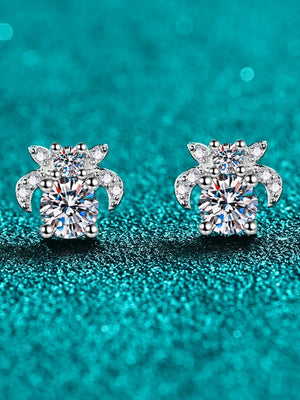 Silver moissanite floral cluster stud earrings with sparkling cubic zirconia accents.