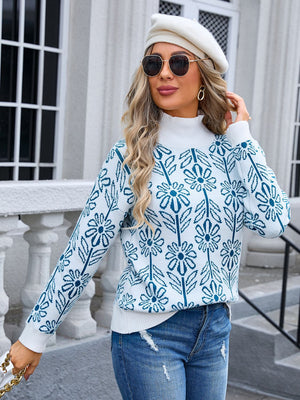 Geometric floral knit turtleneck pullover in white with blue pattern, acrylic, long sleeves.