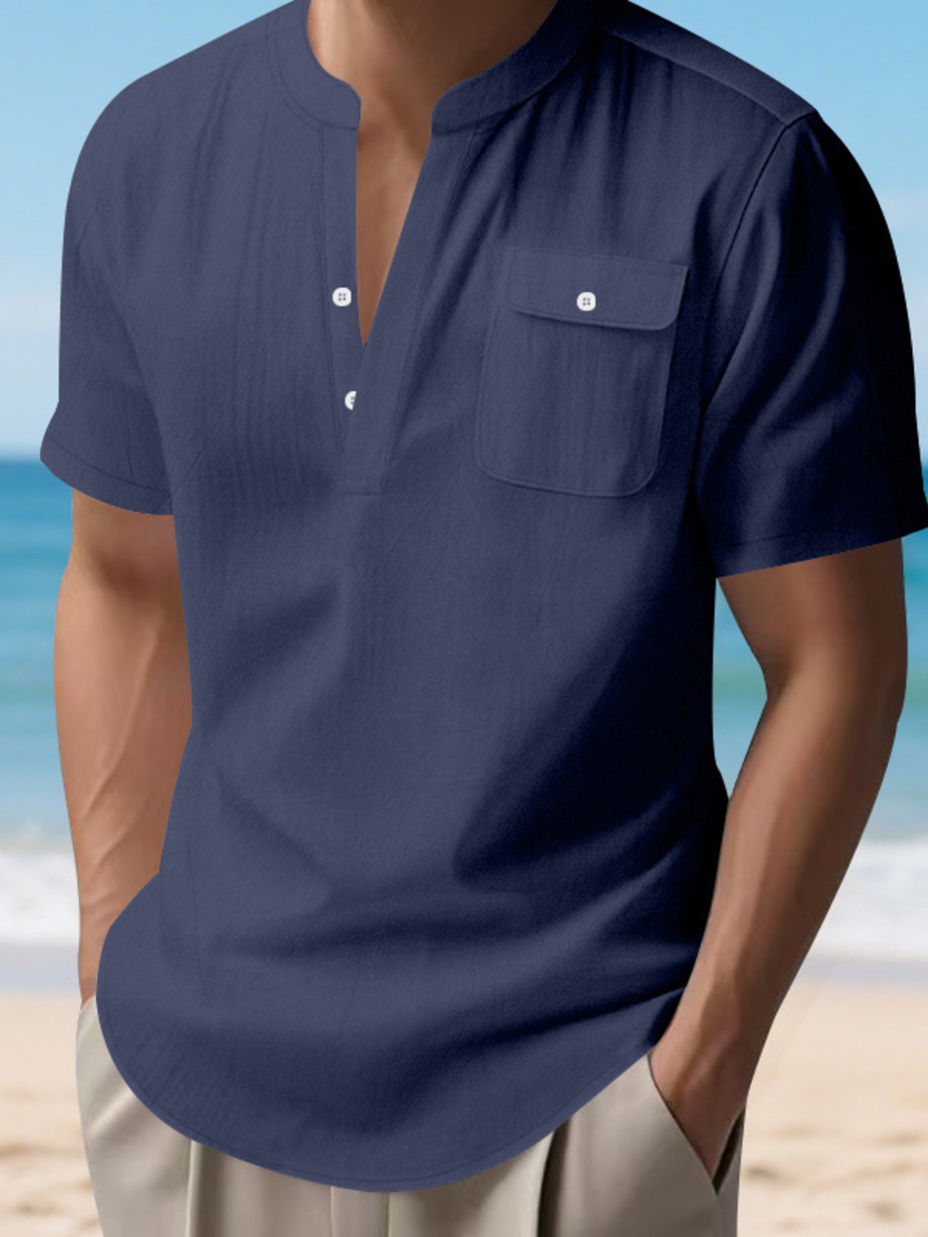Navy blue short sleeve henley shirt with band collar and chest pocket.