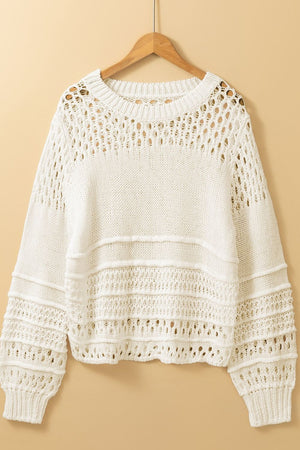Ivory openwork knit pullover sweater with balloon sleeves and textured details.