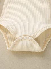 Cream ribbed cotton blend baby bodysuit with snap closure detail