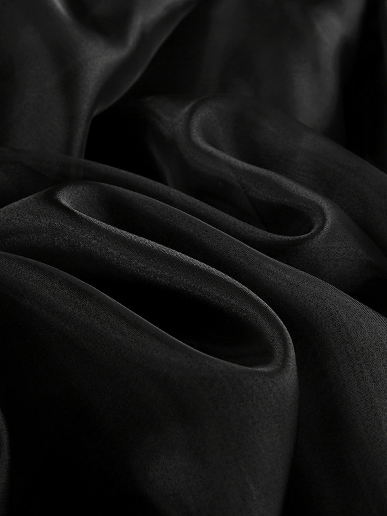 Black midi skirt with sheer overlay, draped fabric detail