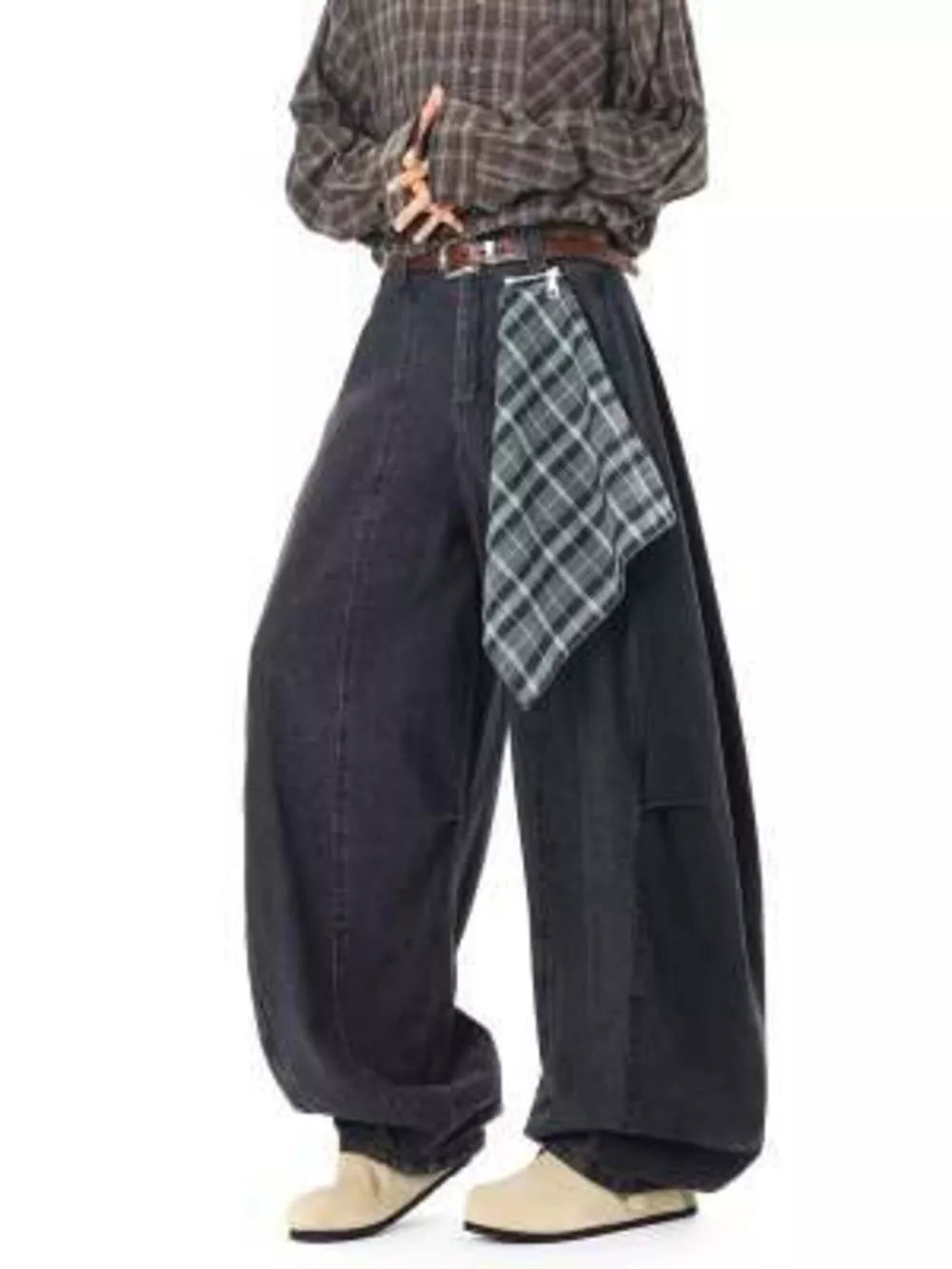 Belted wide-leg vintage wash jeans with a plaid accent detail.