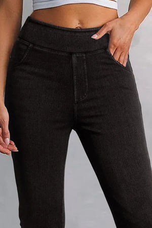 Dark jeggings with faux pockets and a high waist, made of cotton blend.