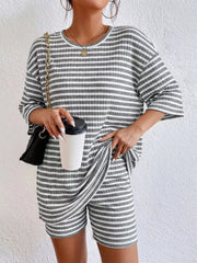 Gray striped two-piece set with elbow sleeves and shorts, comfortable casual outfit.
