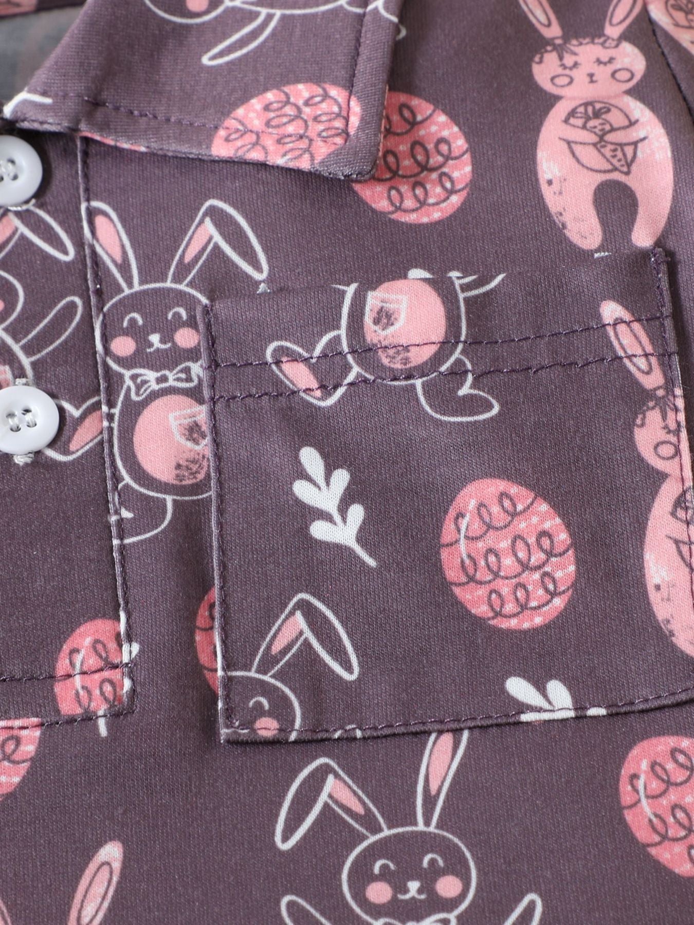 Baby cotton shirt with bunny and Easter egg print, featuring a pocket and button closure.