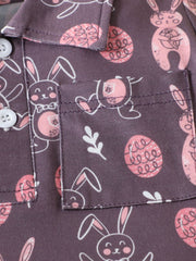 Baby cotton shirt with bunny and Easter egg print, featuring a pocket and button closure.