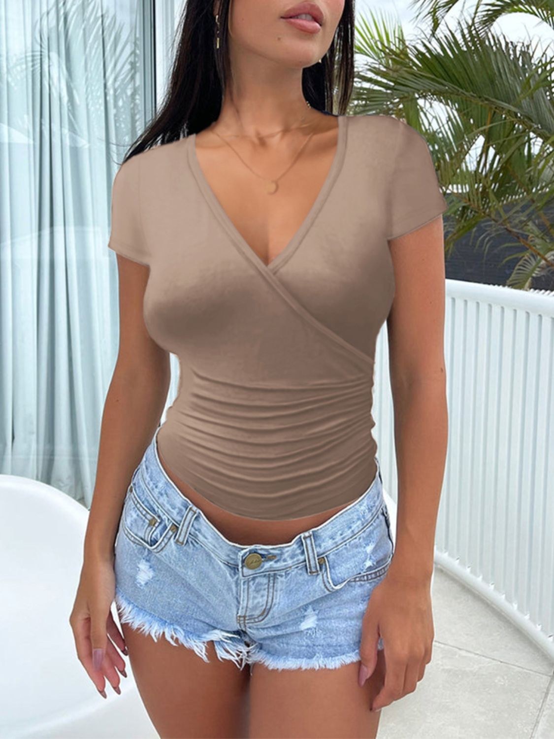 Camel wrap-front jersey t-shirt with ruched sides and short sleeves.