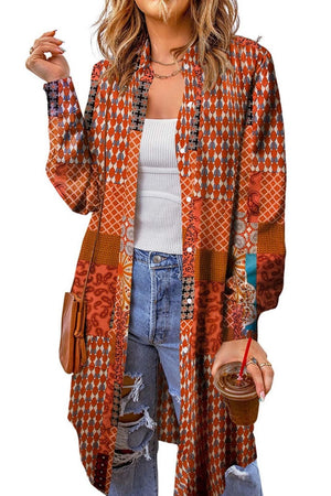 Patchwork print duster shirt jacket in orange with button front and long sleeves.