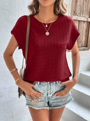 Burgundy woven texture cap-sleeve blouse with a crew neck.