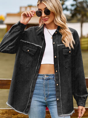 Black overshirt with frayed edges and patch pockets, button front, collared, long sleeves.