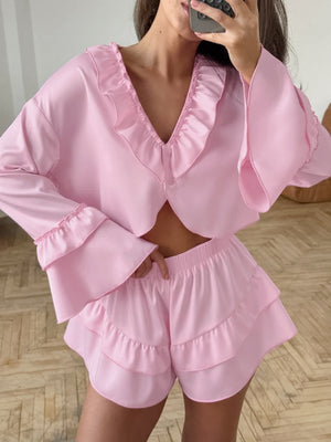 Pink ruffled V-neck pajama set with shorts and bell sleeves