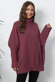 Burgundy ribbed turtleneck sweater with batwing sleeves and ribbed cuffs.