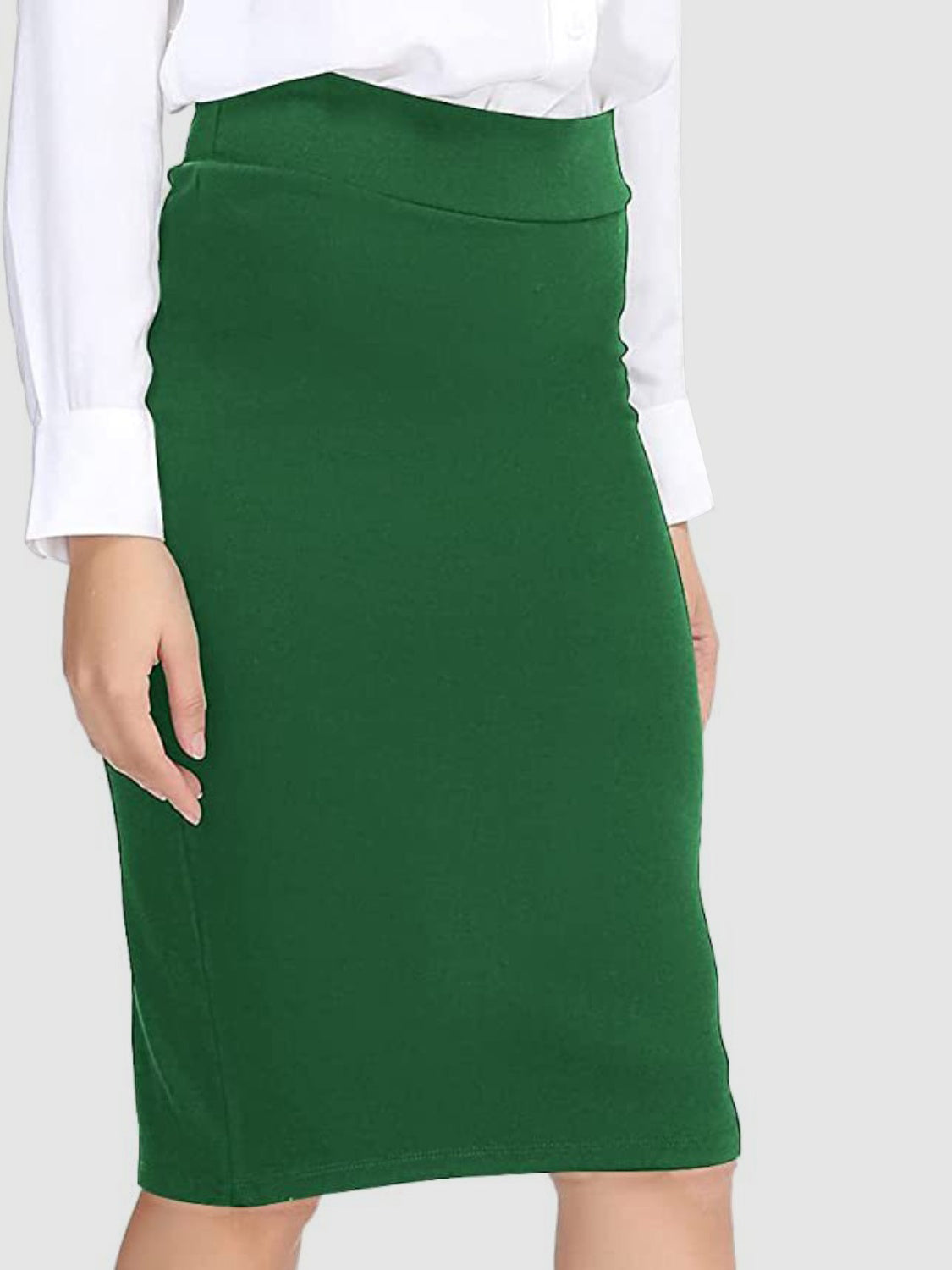 Green pencil skirt with a high waist, styled with a white button-down shirt.