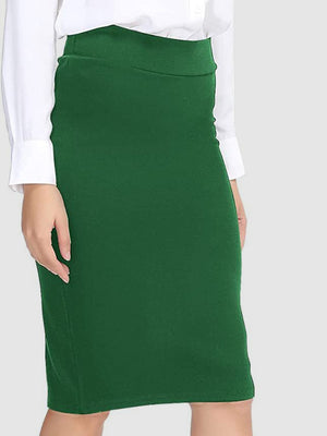 Green pencil skirt with a high waist, styled with a white button-down shirt.