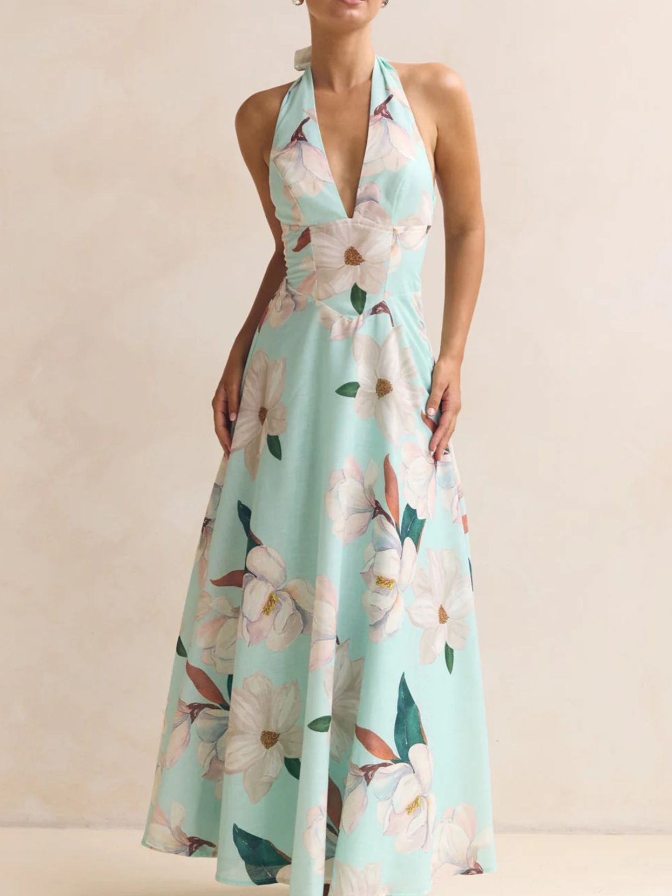 Light blue floral halter neck maxi dress with a-line cut and deep V-neck.