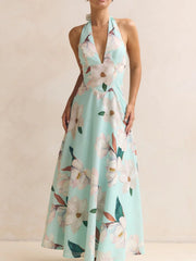 Light blue floral halter neck maxi dress with a-line cut and deep V-neck.