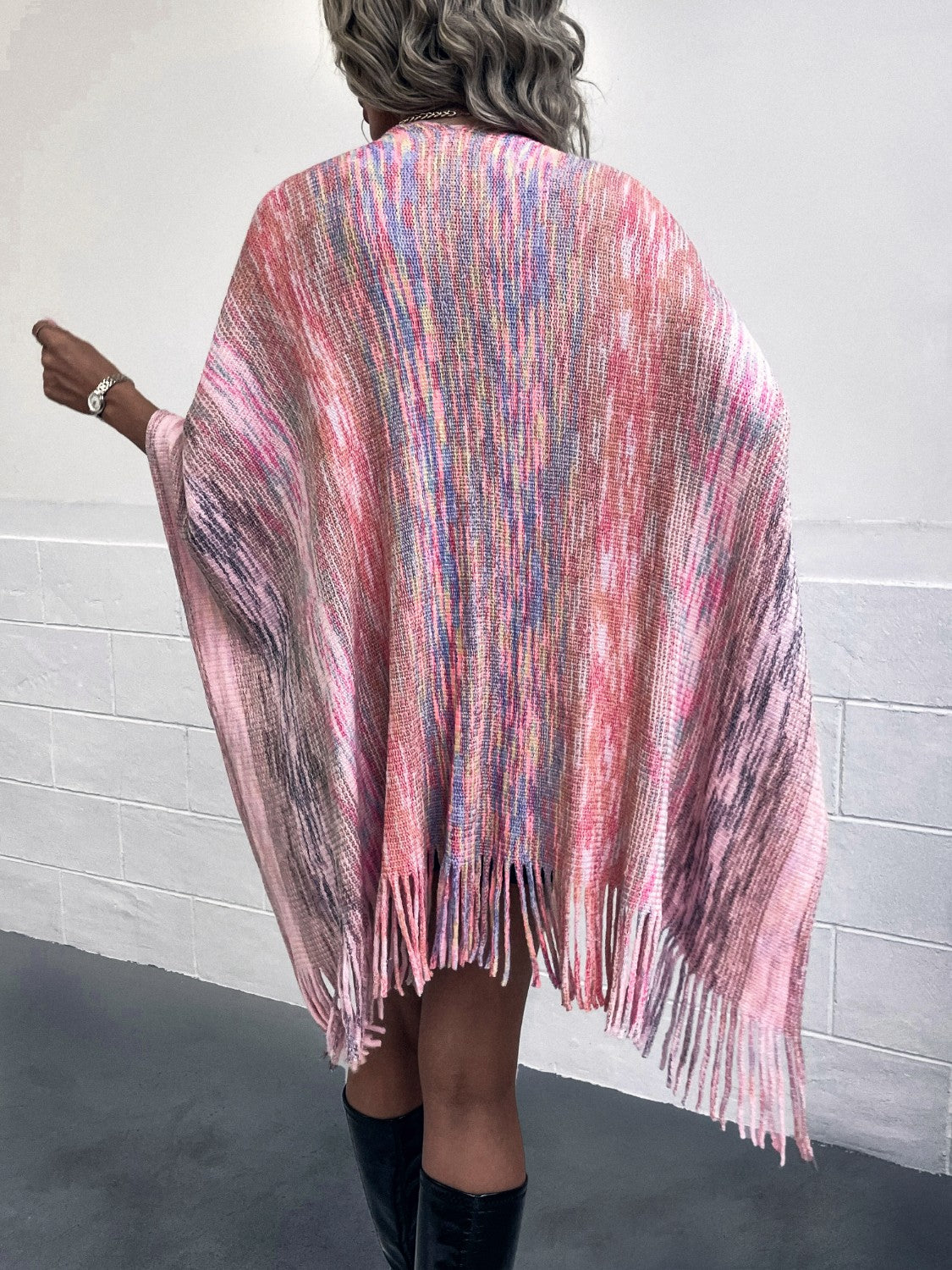 Knit wrap coat with fringe hem and multicolor yarn dye pattern.