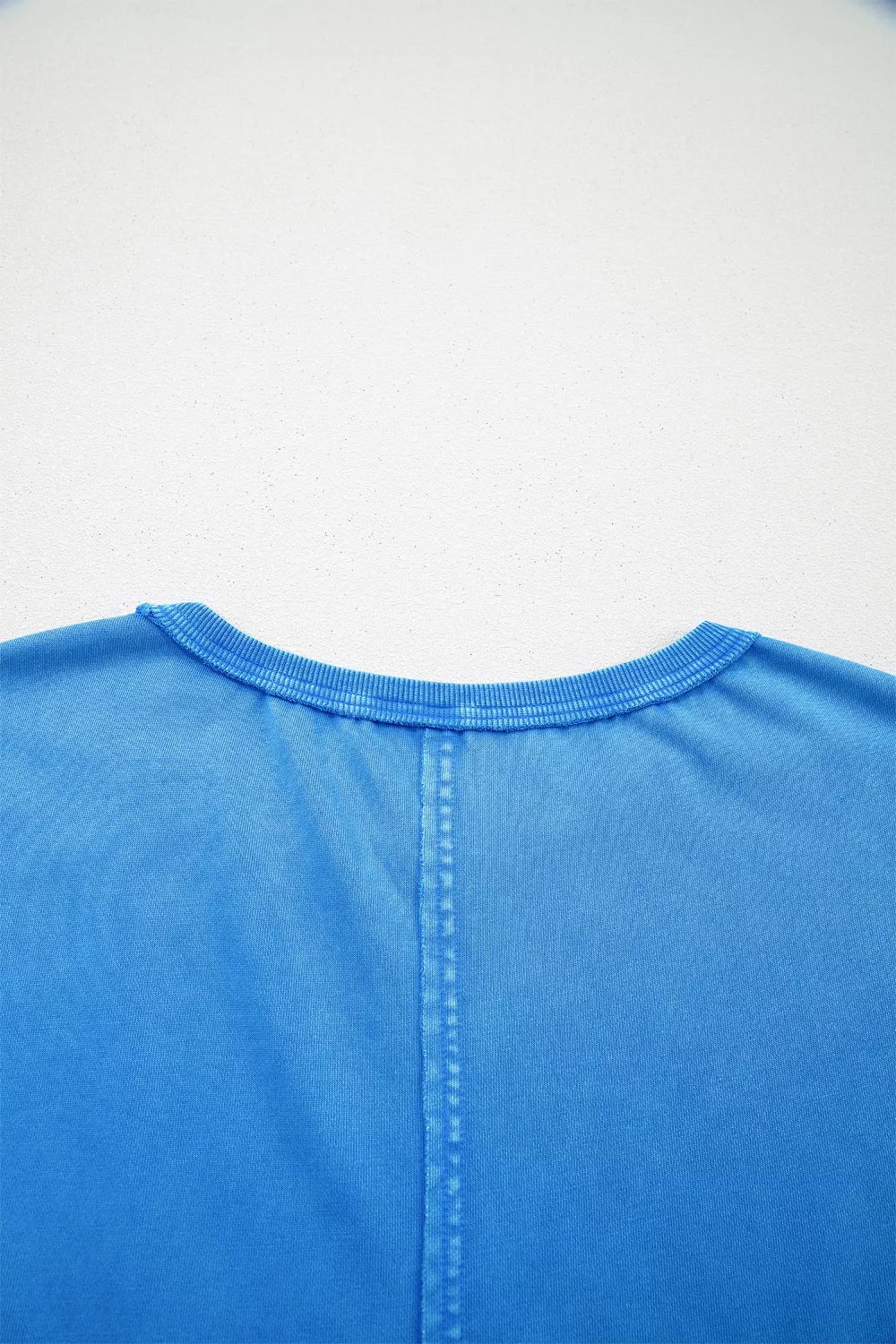 Blue mineral wash cotton tee with crew neck and center seam detail.