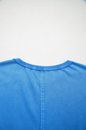 Blue mineral wash cotton tee with crew neck and center seam detail.