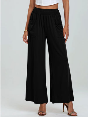 Black elastic waist palazzo trousers with pockets and wide legs.